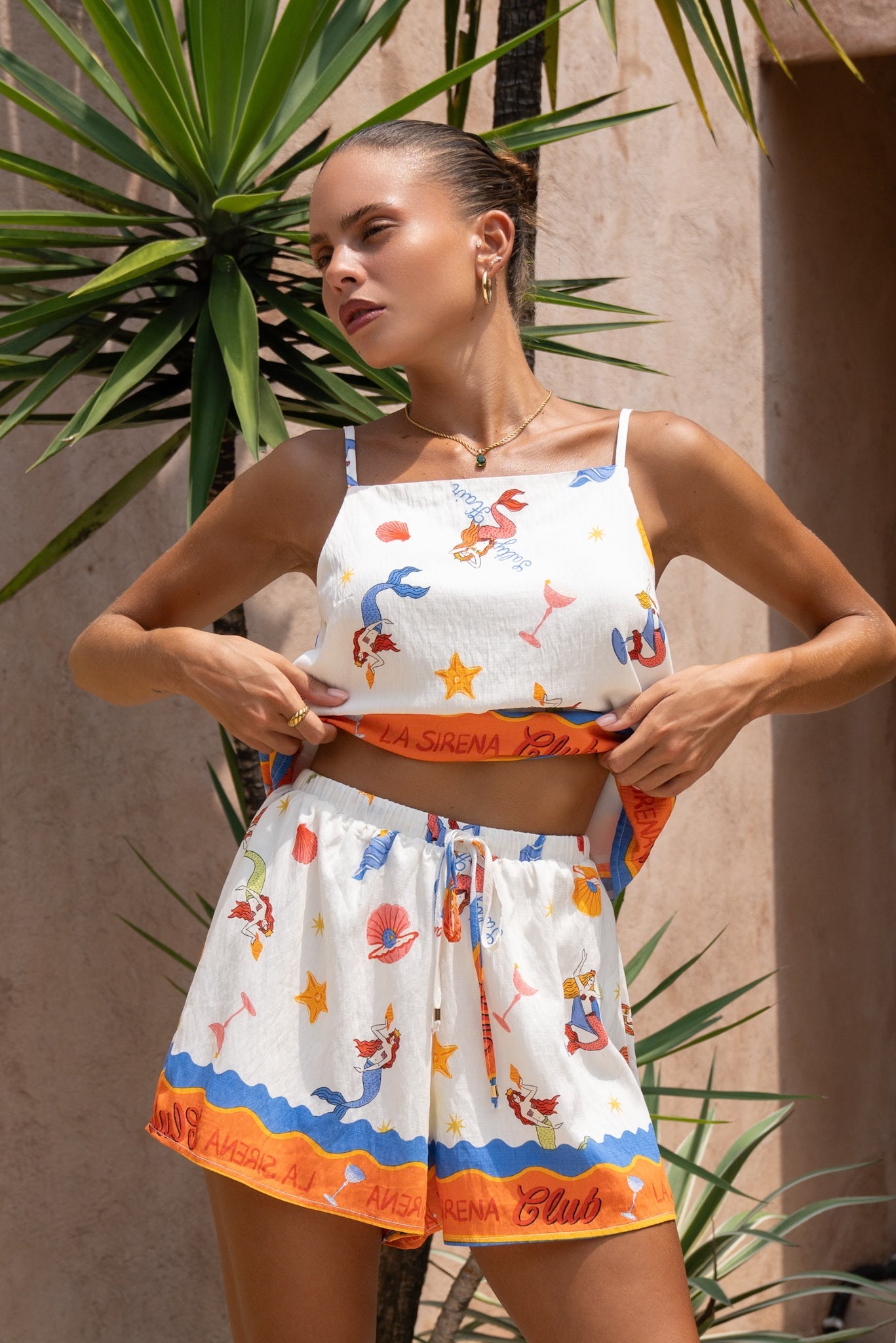 Image of a model wearing Pants. Product name - La Sirena Multicolour Abstract Drawstring Shorts in Multi colour by brand - Heychic