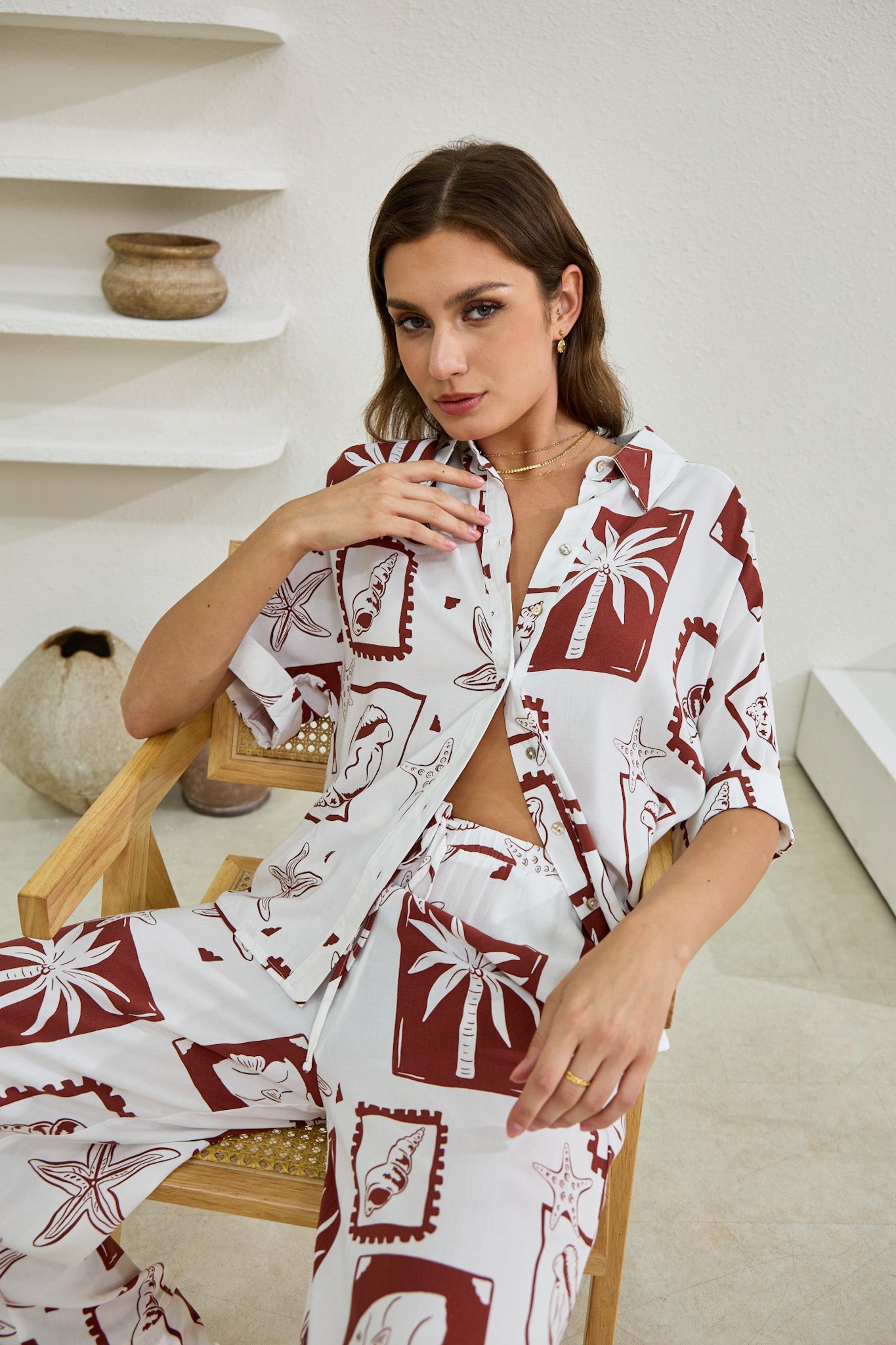 Image of a model wearing Tops. Productname: Heychic Mira Sea Shells Tropical Shirt in Brown colour by brand - Heychic
