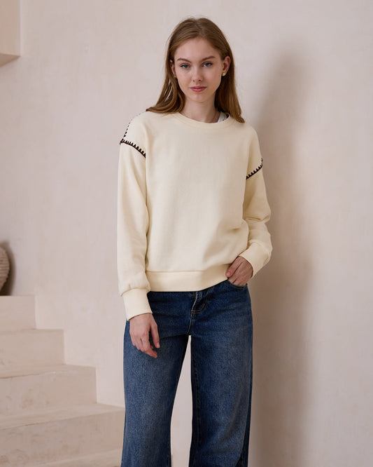 Image of a model wearing Tops. Productname: Heychic Morgan Contrast Stitch Sweat shirt in Cream colour by brand - Heychic