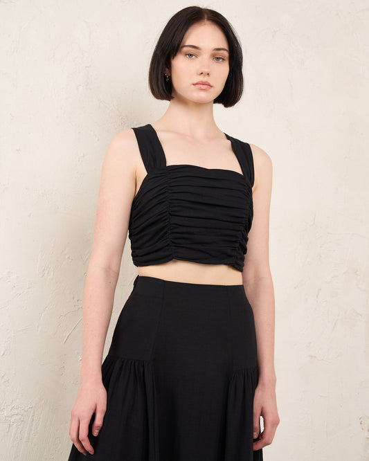 Image of a model wearing Tops. Productname: HEYCHIC Kira Ruched Top in Black colour by brand - HEYCHIC