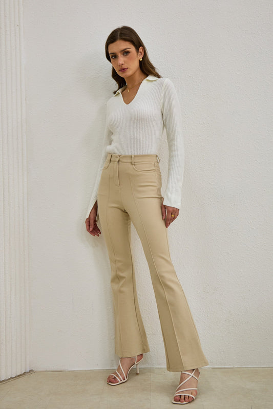 Image of a model wearing Pants. Productname: Heychic Demi Flared Pants in Beige colour by brand - Heychic