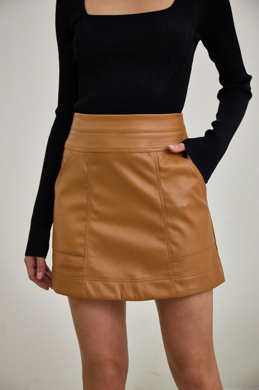 Image of a model wearing Pants. Productname: Heychic Ren Faux Leather PU Mini Skirt in Brown colour by brand - Heychic