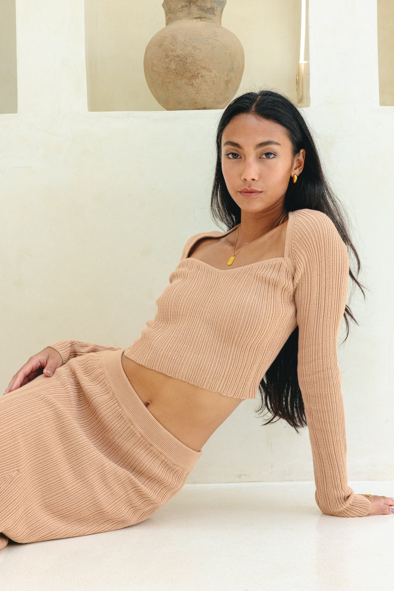 Image of a model wearing Tops. Product name - Valerie Mocha Long Sleeve Knit Top in Top colour by brand - Heychic