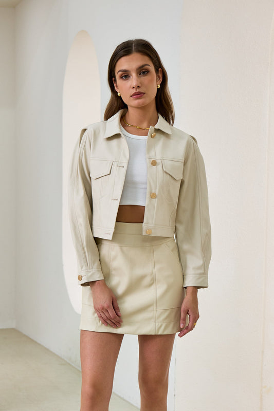Image of a model wearing Tops. Productname: Heychic Aston Cropped Faux Leather Jacket in Beige colour by brand - Heychic