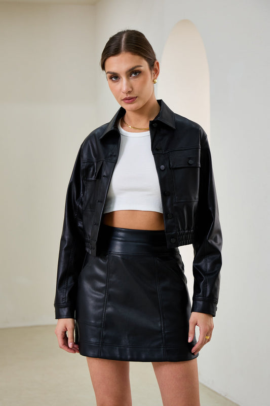 Image of a model wearing Tops. Productname: Heychic Maddox Faux Leather PU Cropped Jacket in Black colour by brand - Heychic