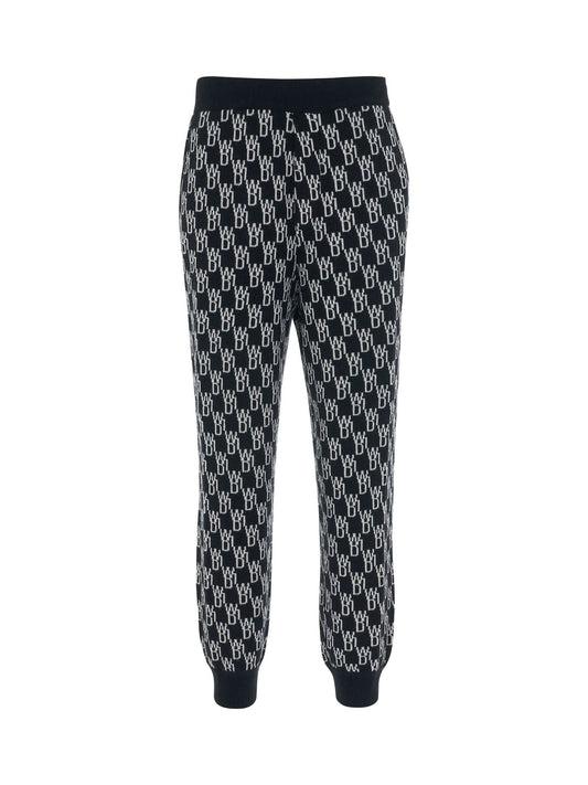 Image of a model wearing Pants. Productname: WE11DONE Monogram Knit Jacquard Trouser in BLACK colour by brand - WE11DONE