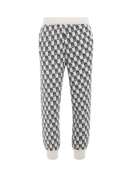 Image of a model wearing Pants. Productname: WE11DONE Logo Knit Jacquard Trouser in WHITE colour by brand - WE11DONE