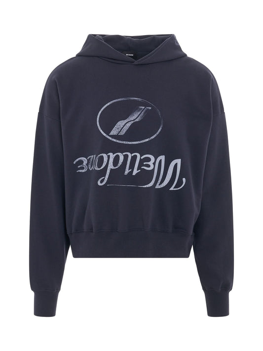 Image of a model wearing Outerwear. Productname: WE11DONE Reversed Logo Medium Hoodie in NAVY colour by brand - WE11DONE