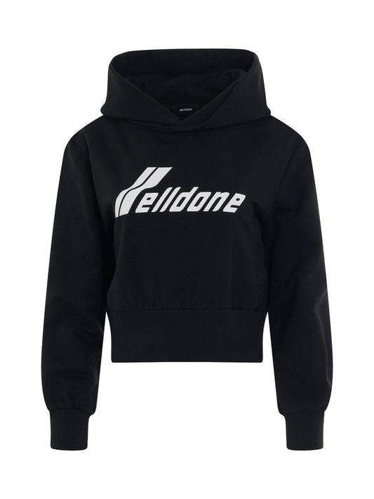 Image of a model wearing Outerwear. Productname: WE11DONE Lettering Symbol Crop Hoodie in BLACK colour by brand - WE11DONE