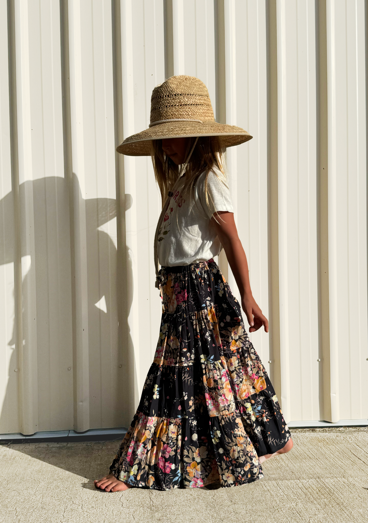 Image of a model wearing Skirts. Productname: LITTLE AUGUSTE Little Miss Maxi Skirt in Black colour by brand - LITTLE AUGUSTE