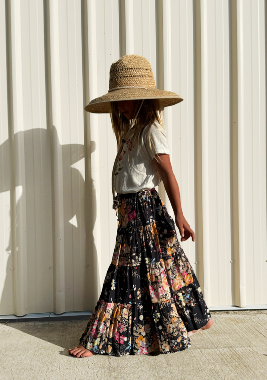 Image of a model wearing Skirts. Productname: LITTLE AUGUSTE Little Miss Maxi Skirt in Black colour by brand - LITTLE AUGUSTE
