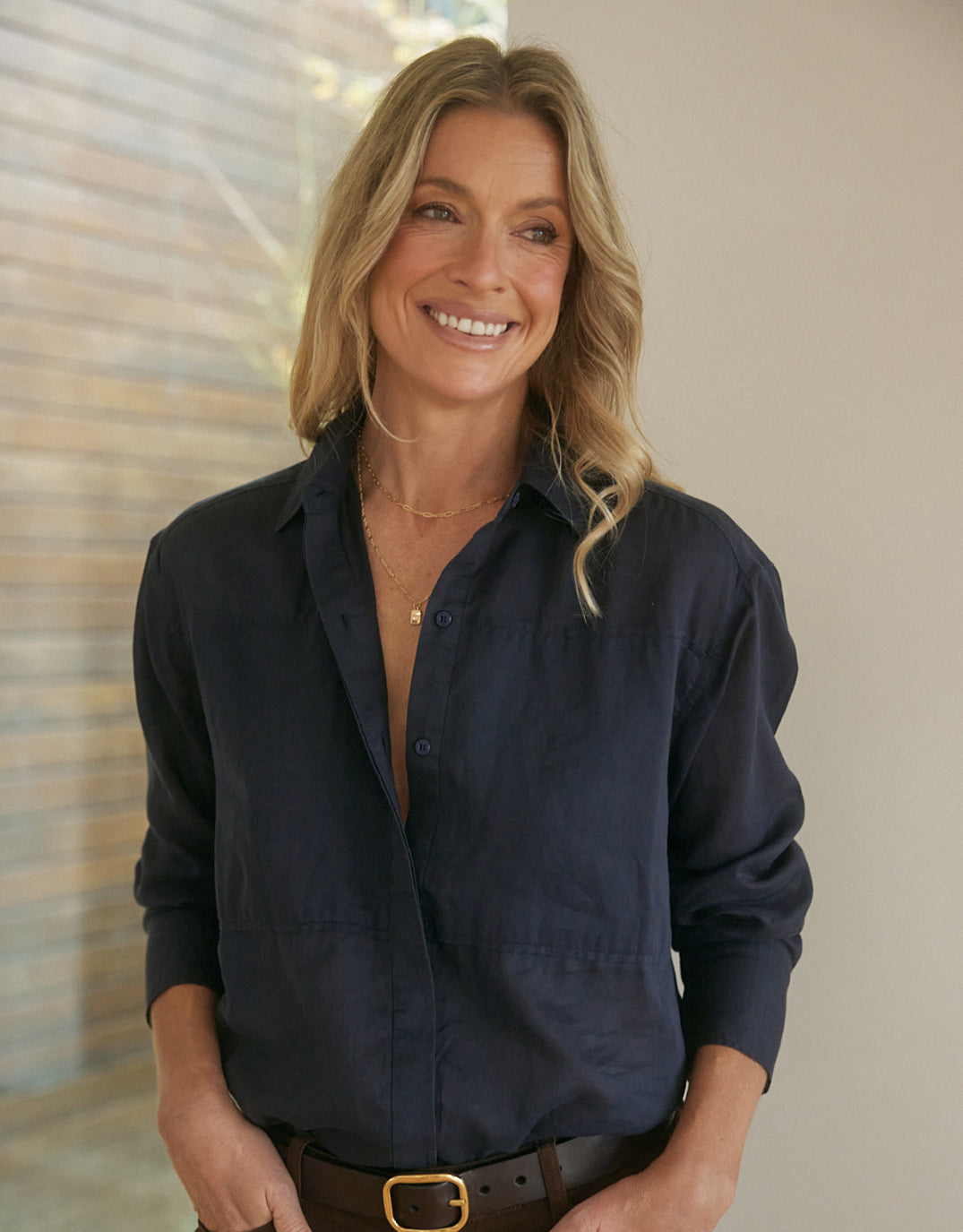Image of a model wearing Tops. Product name - Chloe Panel Shirt Navy in Navy colour by brand - White & Co.