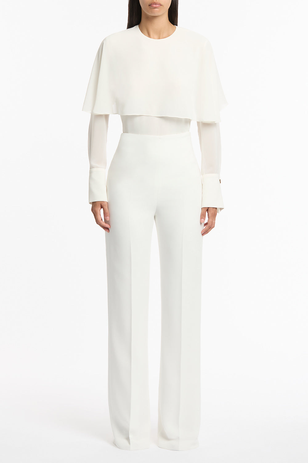 Image of a model wearing Pants. Product name - White Crepe Wide Classic Pant in White colour by brand - Carla Zampatti