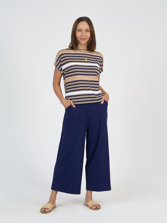 Image of a model wearing Tops. Product name - Wilde Bamboo Box Fit Tee Stripe in Stripe colour by brand - Lou Lou