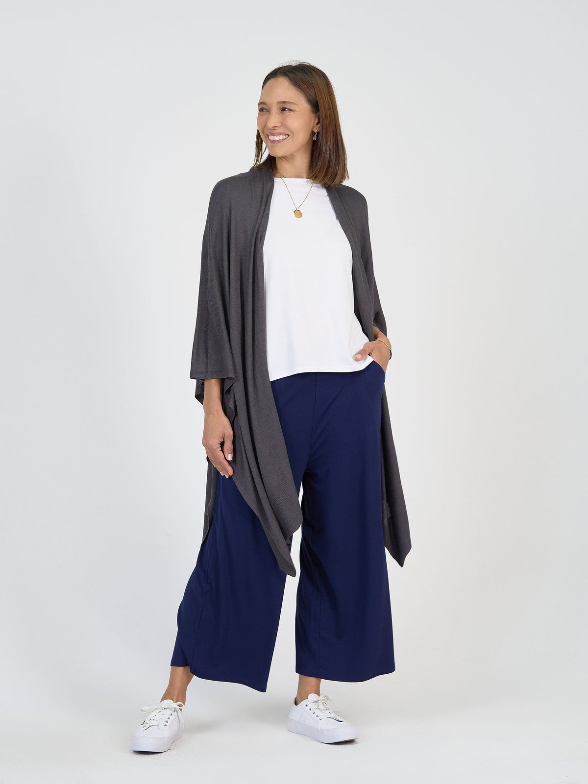 Image of a model wearing Outerwear. Product name - Supreme Cashmere/Bamboo Travel Wrap Steel in Steel colour by brand - Lou Lou