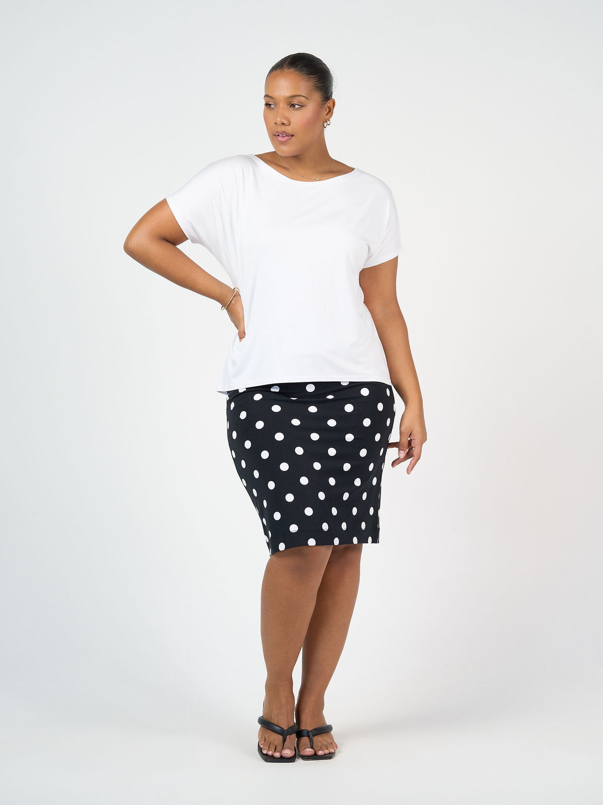 Image of a model wearing Tops. Product name - Wilde Bamboo Box Fit Tee White in White colour by brand - Lou Lou