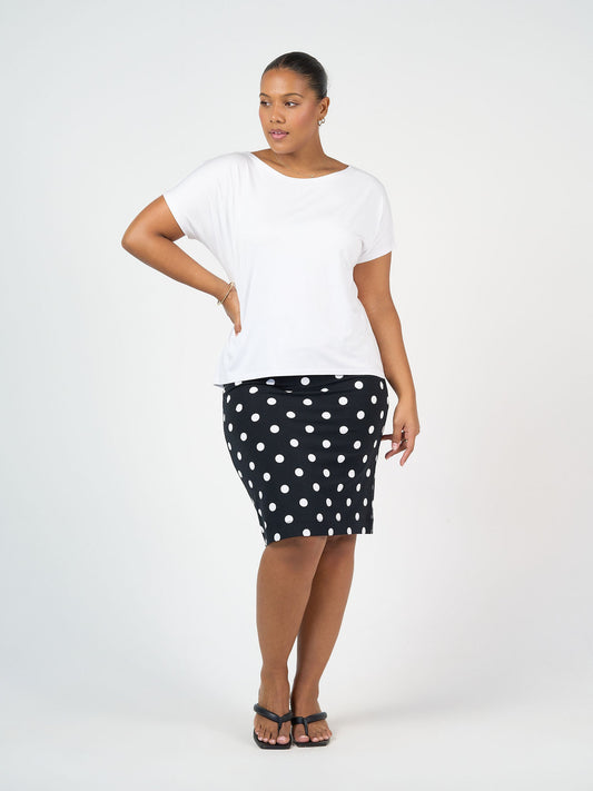 Image of a model wearing Tops. Product name - Wilde Bamboo Box Fit Tee White in White colour by brand - Lou Lou