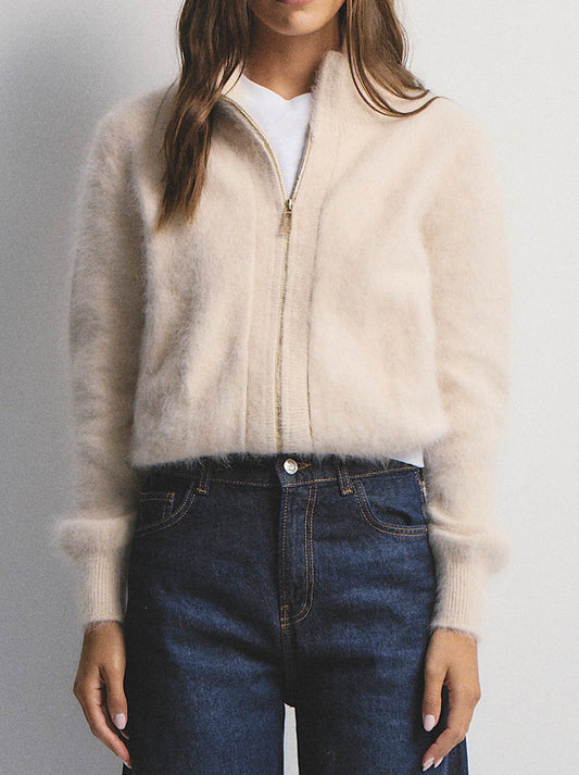 Image of a model wearing Outerwear. Productname: WORLD OF NOMADS FELIX ZIP CASHMERE CARDIGAN in Oatmeal colour by brand - World Of Nomads