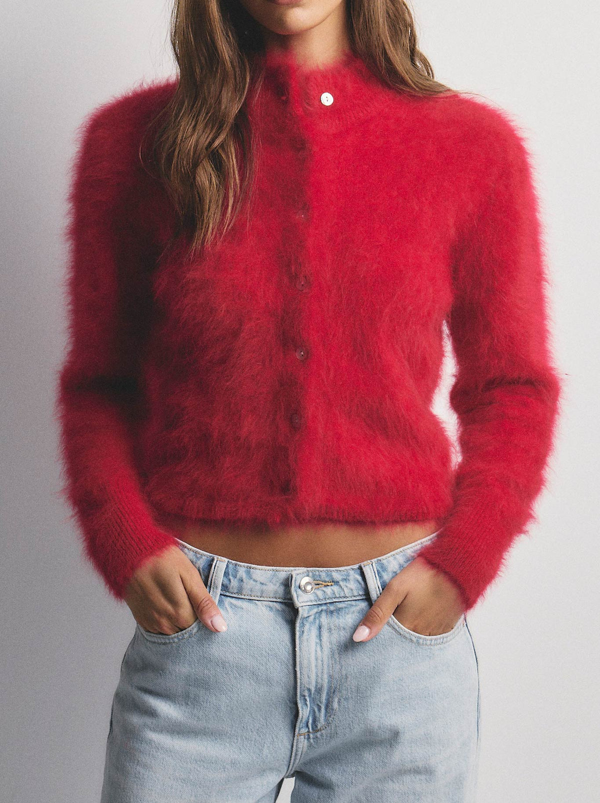 Image of a model wearing Outerwear. Product name - WORLD OF NOMADS BELLA CASHMERE CARDIGAN in Flame colour by brand - World Of Nomads