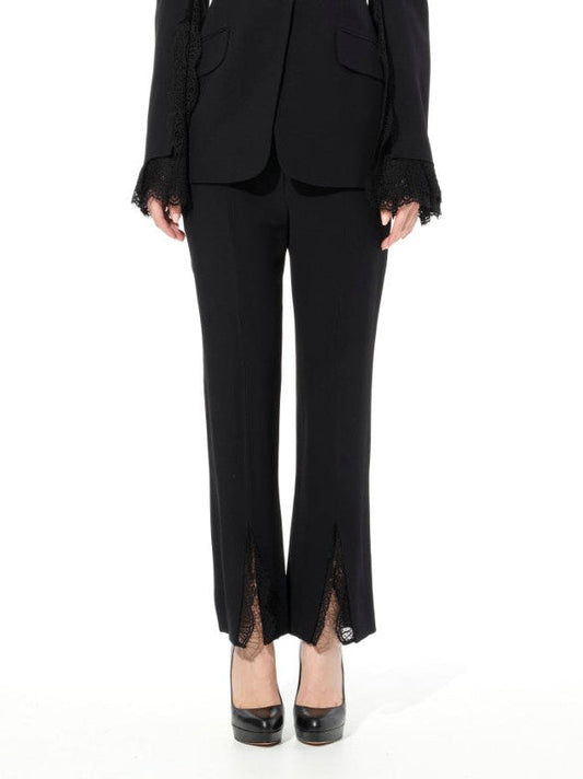 Image of a model wearing Pants. Productname: ALEXANDER MCQUEEN Leaf Lace Cig Pants in BLACK colour by brand - ALEXANDER MCQUEEN