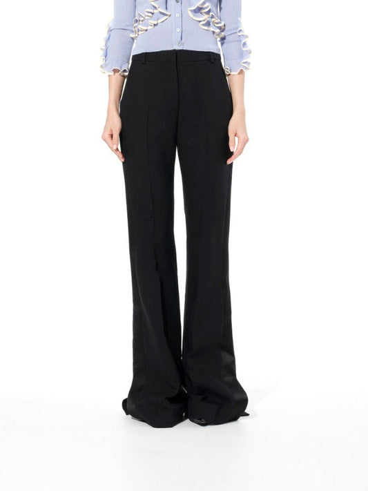 Image of a model wearing Pants. Product name - Alexander McQueen Light Wool Pant in Black colour by brand - ALEXANDER MCQUEEN