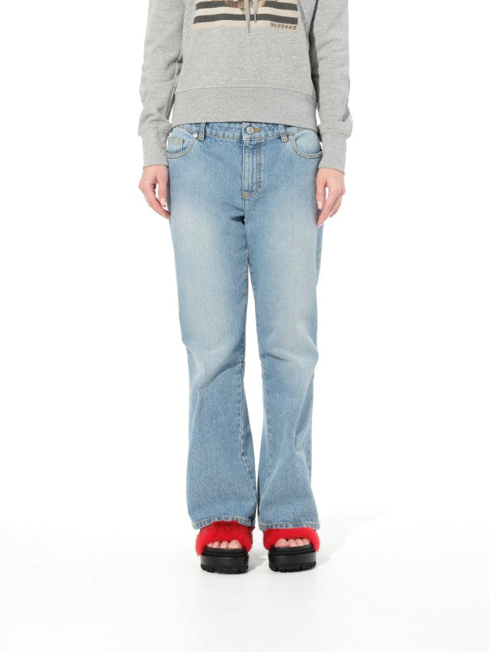 Image of a model wearing Pants. Productname: ALEXANDER MCQUEEN Faded Denim Pant in DENIM colour by brand - ALEXANDER MCQUEEN