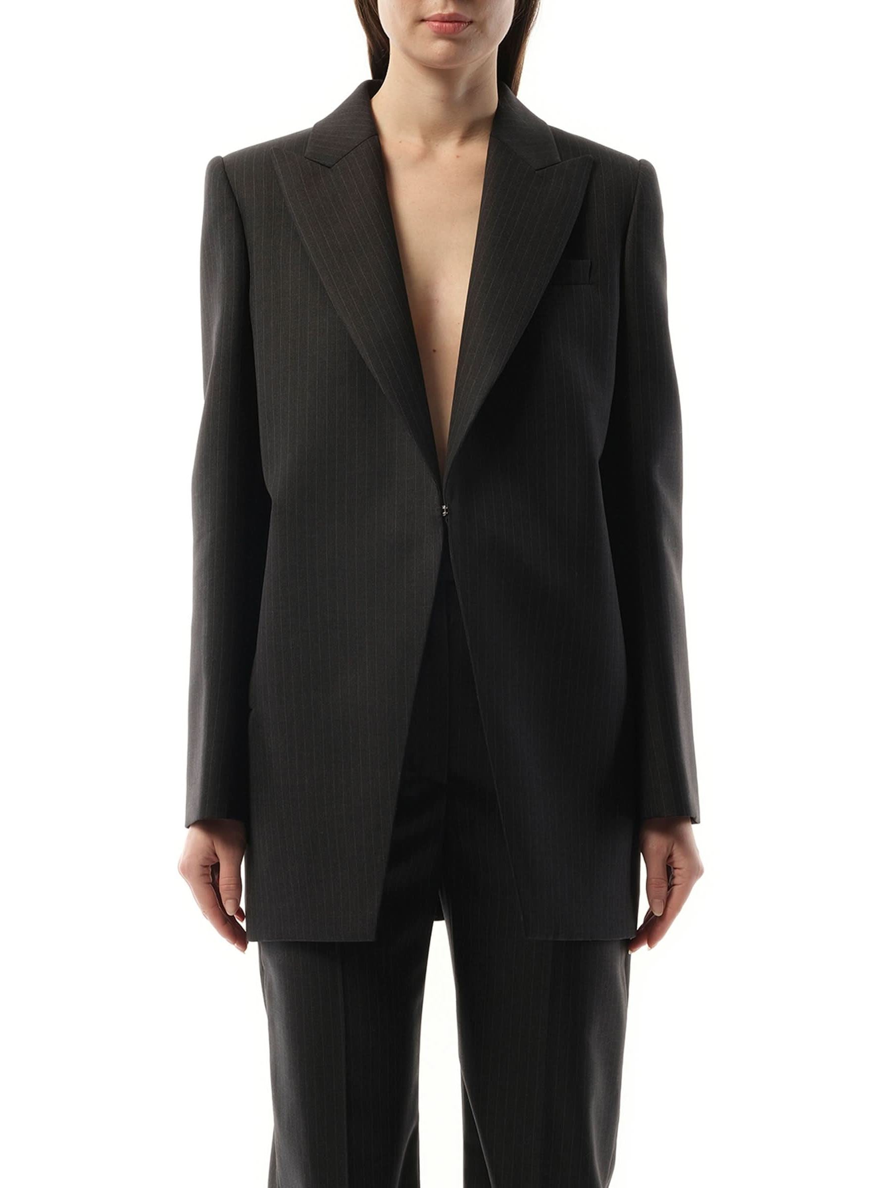 Image of a model wearing Outerwear. Productname: ALEXANDER MCQUEEN Cut Away Long Jacket in Grey colour by brand - ALEXANDER MCQUEEN