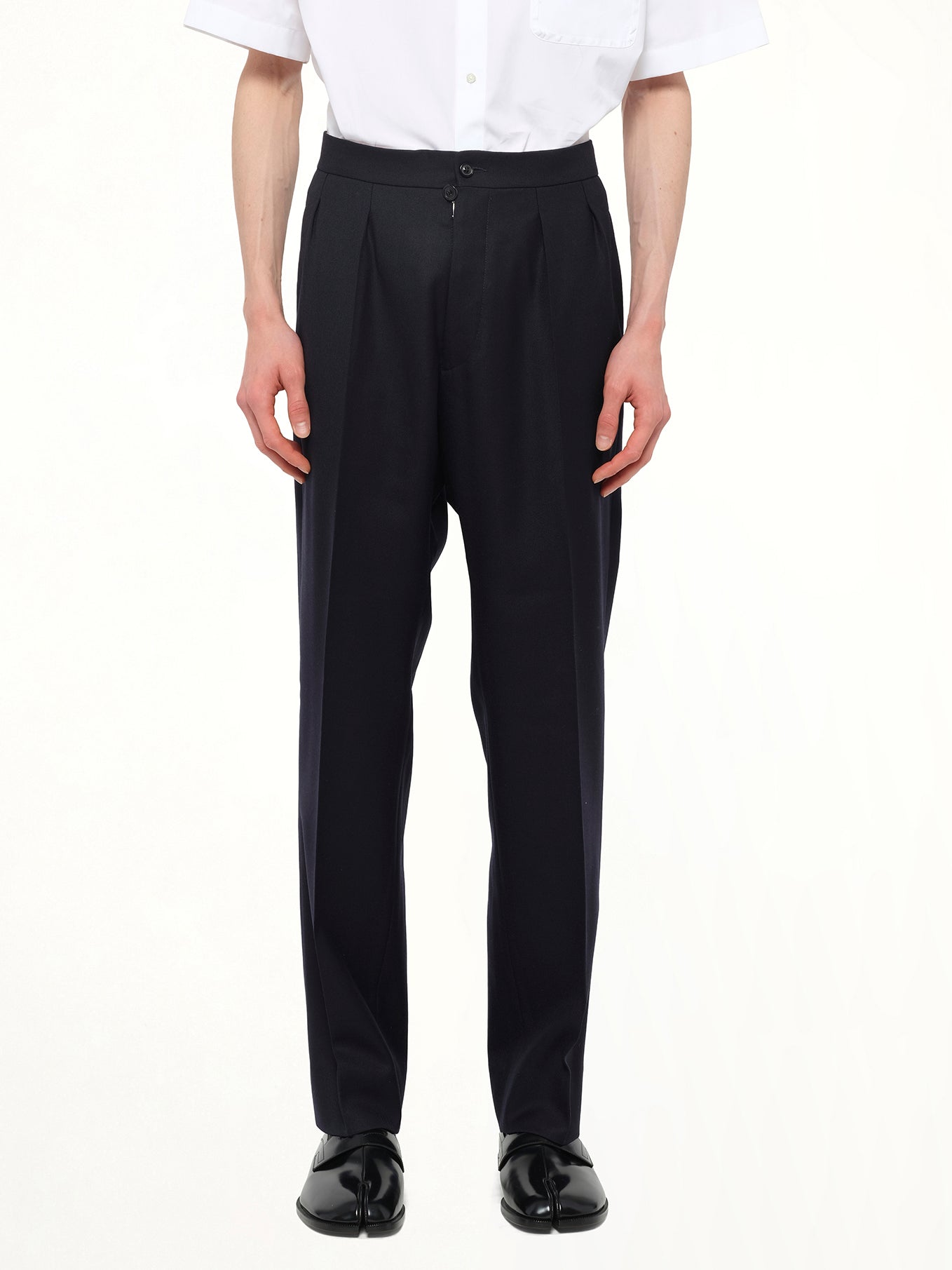 Image of a model wearing Pants. Product name - Wool Twill Pants in Blue colour by brand - MAISON MARGIELA