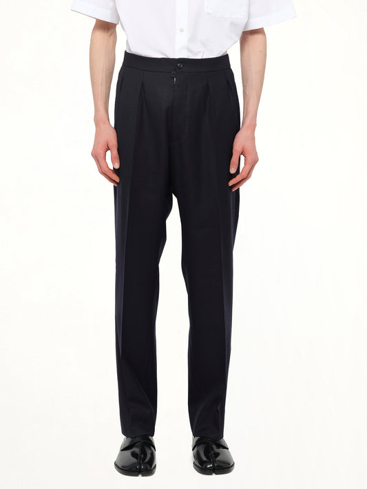 Image of a model wearing Pants. Product name - Wool Twill Pants in Blue colour by brand - MAISON MARGIELA