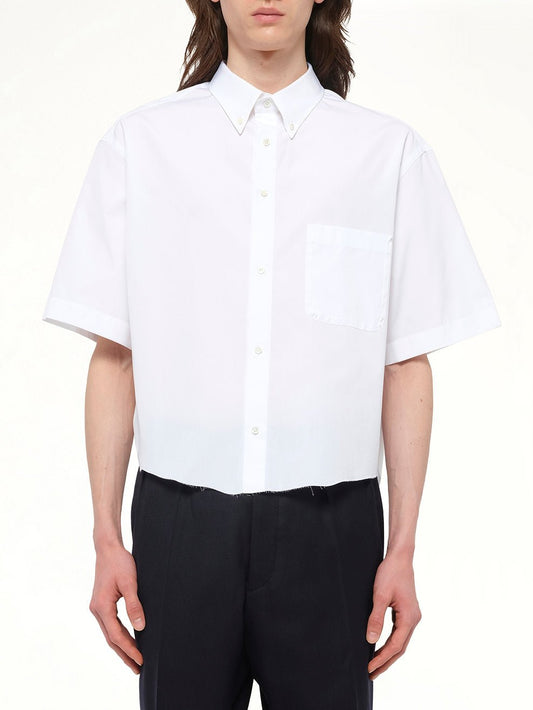 Image of a model wearing Tops. Product name - Short-sleeved Shirt in White colour by brand - MAISON MARGIELA