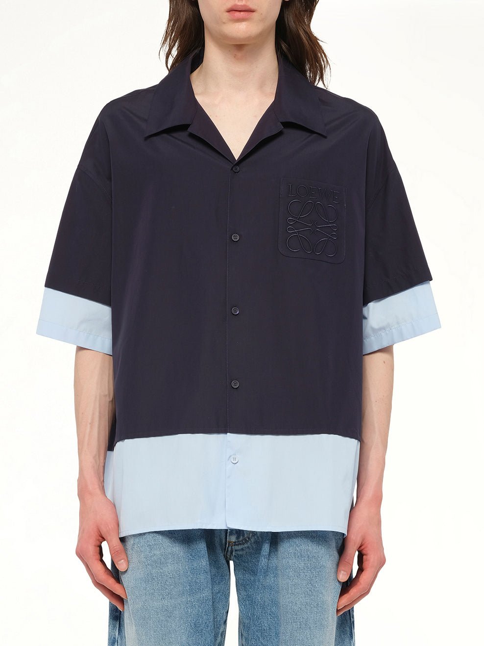 Image of a model wearing Tops. Product name - Short Sleeve Shirt in Navy colour by brand - LOEWE