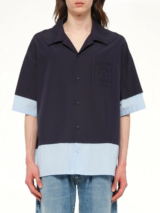 Image of a model wearing Tops. Product name - Short Sleeve Shirt in Navy colour by brand - LOEWE