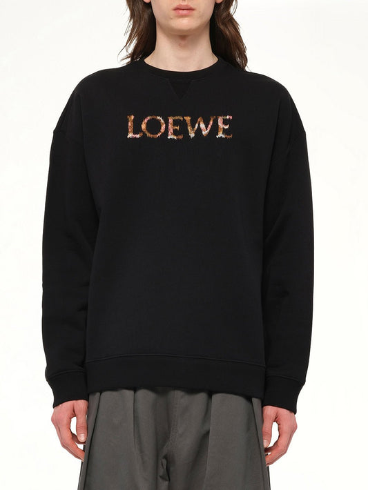 Image of a model wearing Outerwear. Product name - Regular Fit Sweatshirt in Black colour by brand - LOEWE