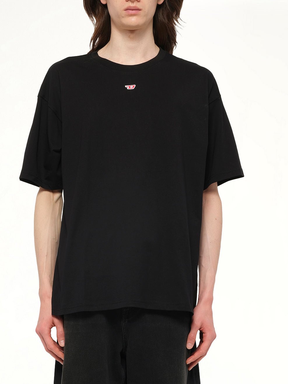 Image of a model wearing Tops. Productname: DIESEL T-BOXT-D T-Shirt in Black colour by brand - DIESEL