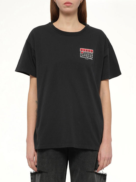 Image of a model wearing Tops. Productname: MAISON MARGIELA "Bingo" T-Shirt in CARBON colour by brand - MAISON MARGIELA