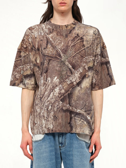 Image of a model wearing Tops. Productname: REPRESENT Realtree Camo T-Shirt in CAMO colour by brand - REPRESENT
