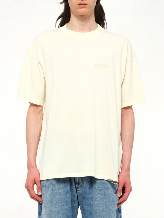 Image of T-Shirts. Product name - Represent Owners Club T-Shirt in Buttercream colour by brand - REPRESENT