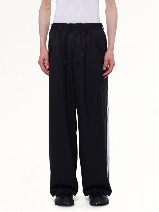 Image of a model wearing Pants. Productname: Y-3 Refined Wool Pants in Black colour by brand - Y-3