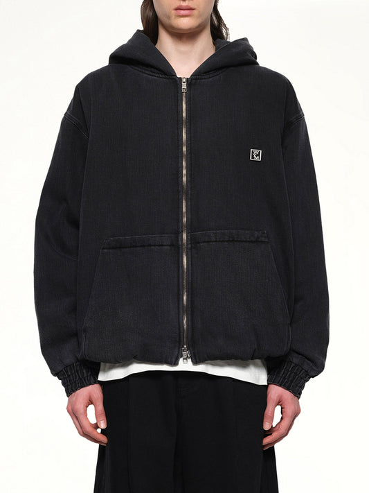 Image of a model wearing Outerwear. Productname: WOOYOUNGMI Dyed Denim Hoodie in BLACK colour by brand - WOOYOUNGMI