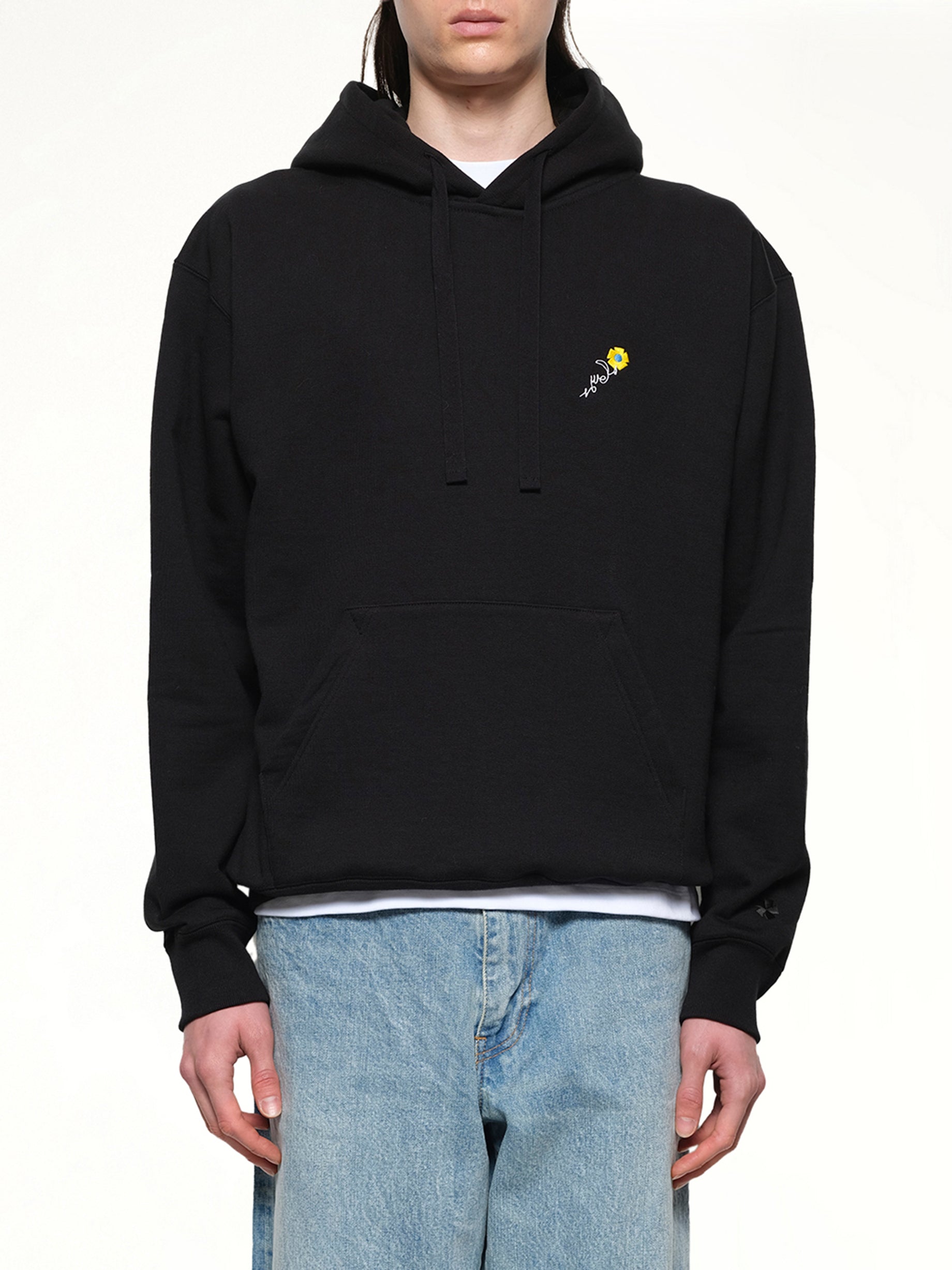Image of a model wearing Outerwear. Productname: VOWELS Floral Embroidered Hoodie in Black colour by brand - VOWELS