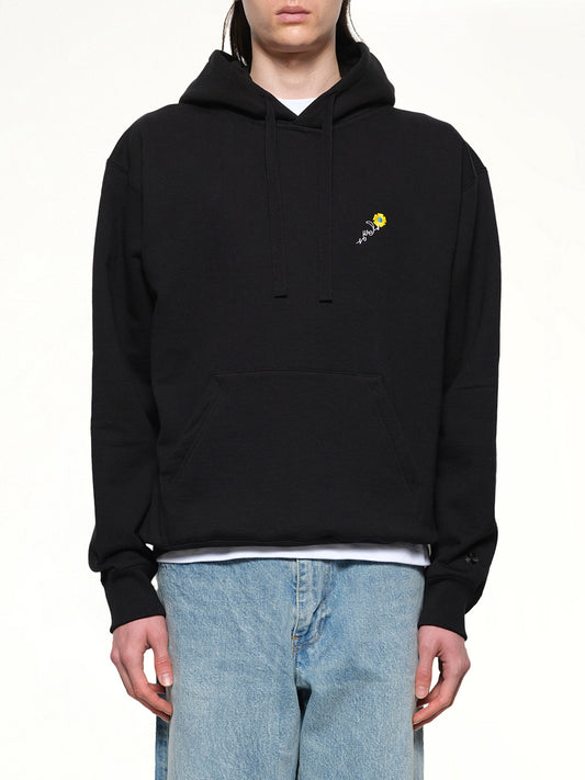 Image of a model wearing Outerwear. Productname: VOWELS Floral Embroidered Hoodie in Black colour by brand - VOWELS