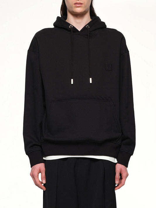 Image of a model wearing Outerwear. Productname: WOOYOUNGMI Flower Petal Hoodie in BLACK colour by brand - WOOYOUNGMI