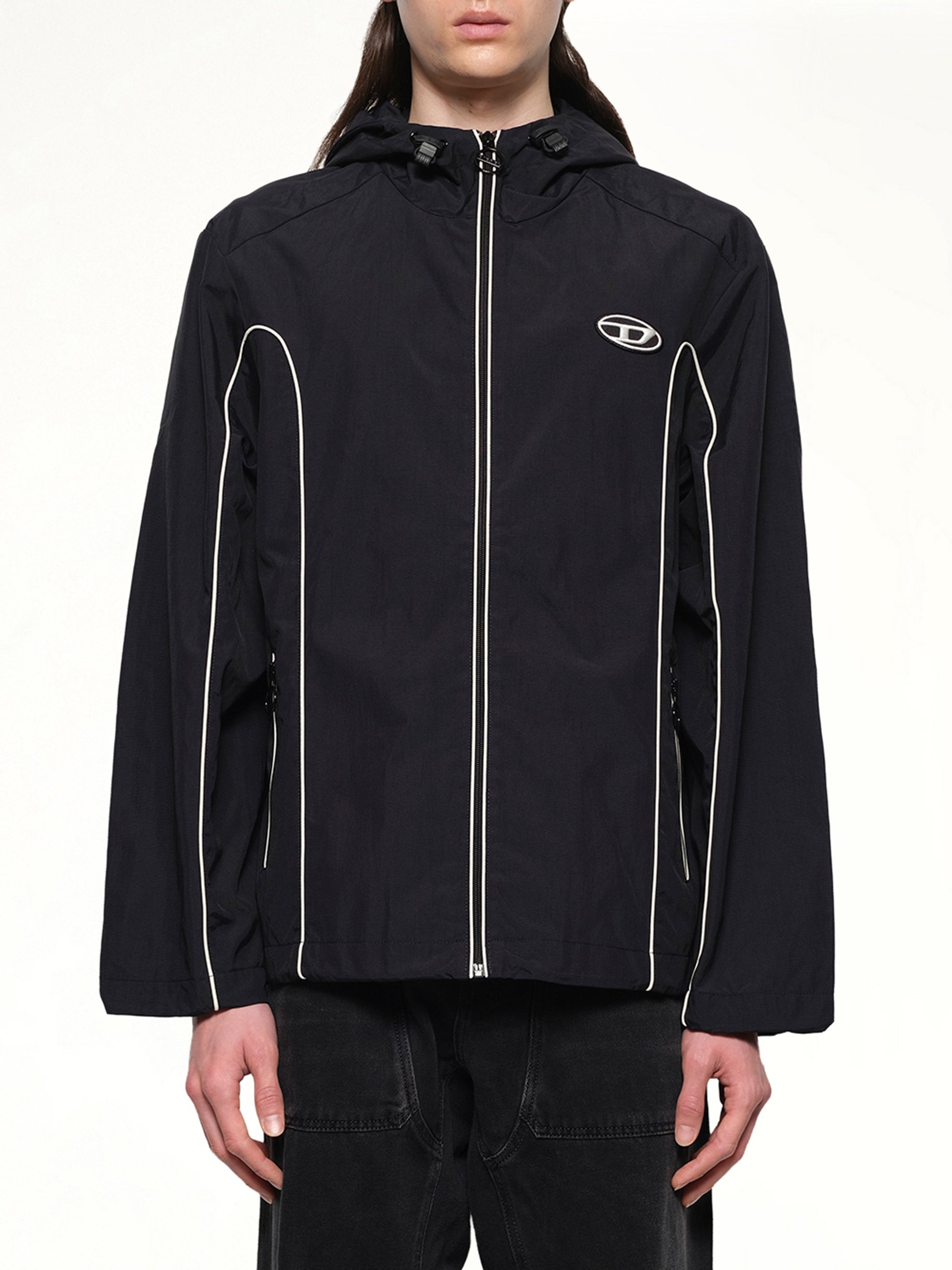 Image of a model wearing Outerwear. Productname: DIESEL J-HIVES Windbreaker in Black colour by brand - DIESEL