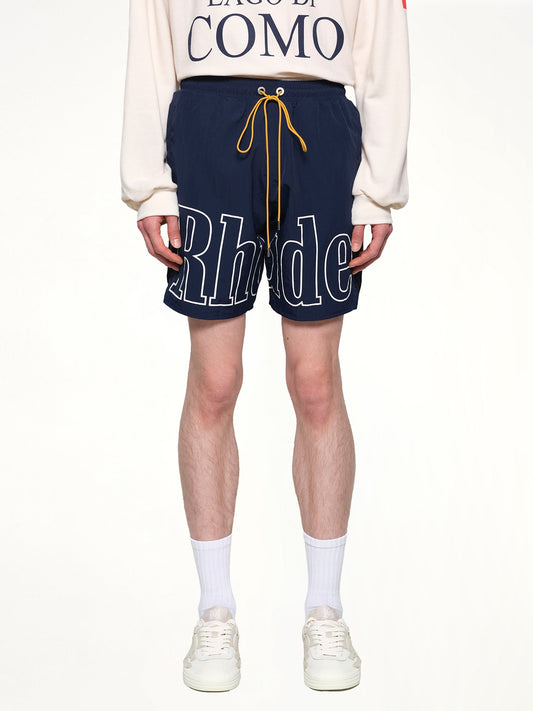 Image of a model wearing Shorts. Productname: RHUDE Rhude Logo Shorts in NAVY colour by brand - RHUDE