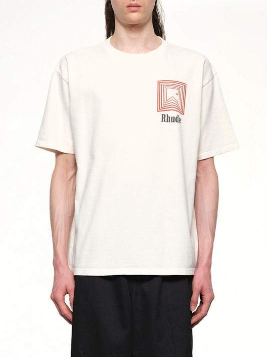 Image of a model wearing Tops. Productname: RHUDE Chevron Logo Repeat T-Shirt in VINTAGE WHITE colour by brand - RHUDE