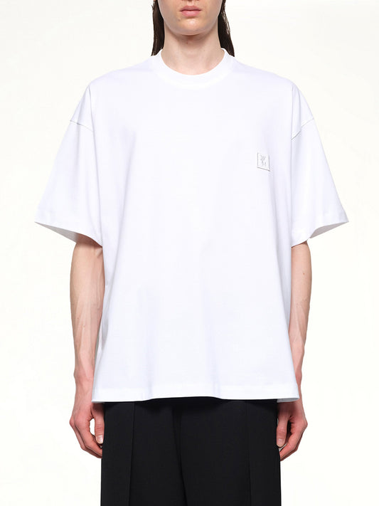 Image of a model wearing Tops. Productname: WOOYOUNGMI City Graphic T-Shirt in WHITE colour by brand - WOOYOUNGMI