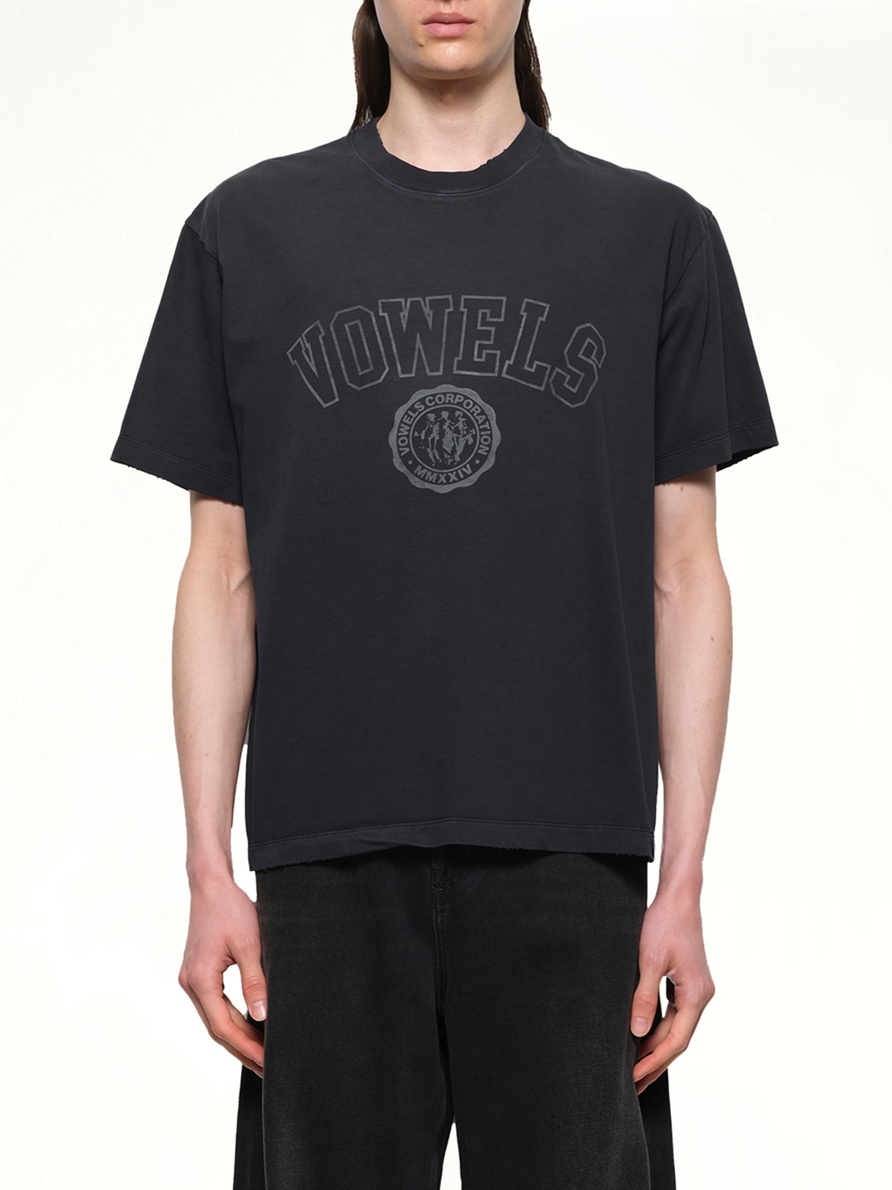 Image of a model wearing Tops. Productname: VOWELS Faded Collegiate T-Shirt in Black colour by brand - VOWELS