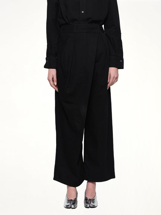 Image of a model wearing Denim. Productname: LOEWE Wrap Jeans AF in Black colour by brand - LOEWE