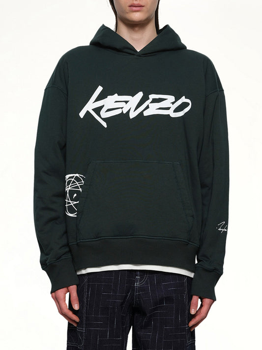 Image of a model wearing Outerwear. Productname: Kenzo Futura Padded Hoodie in Pine colour by brand - KENZO
