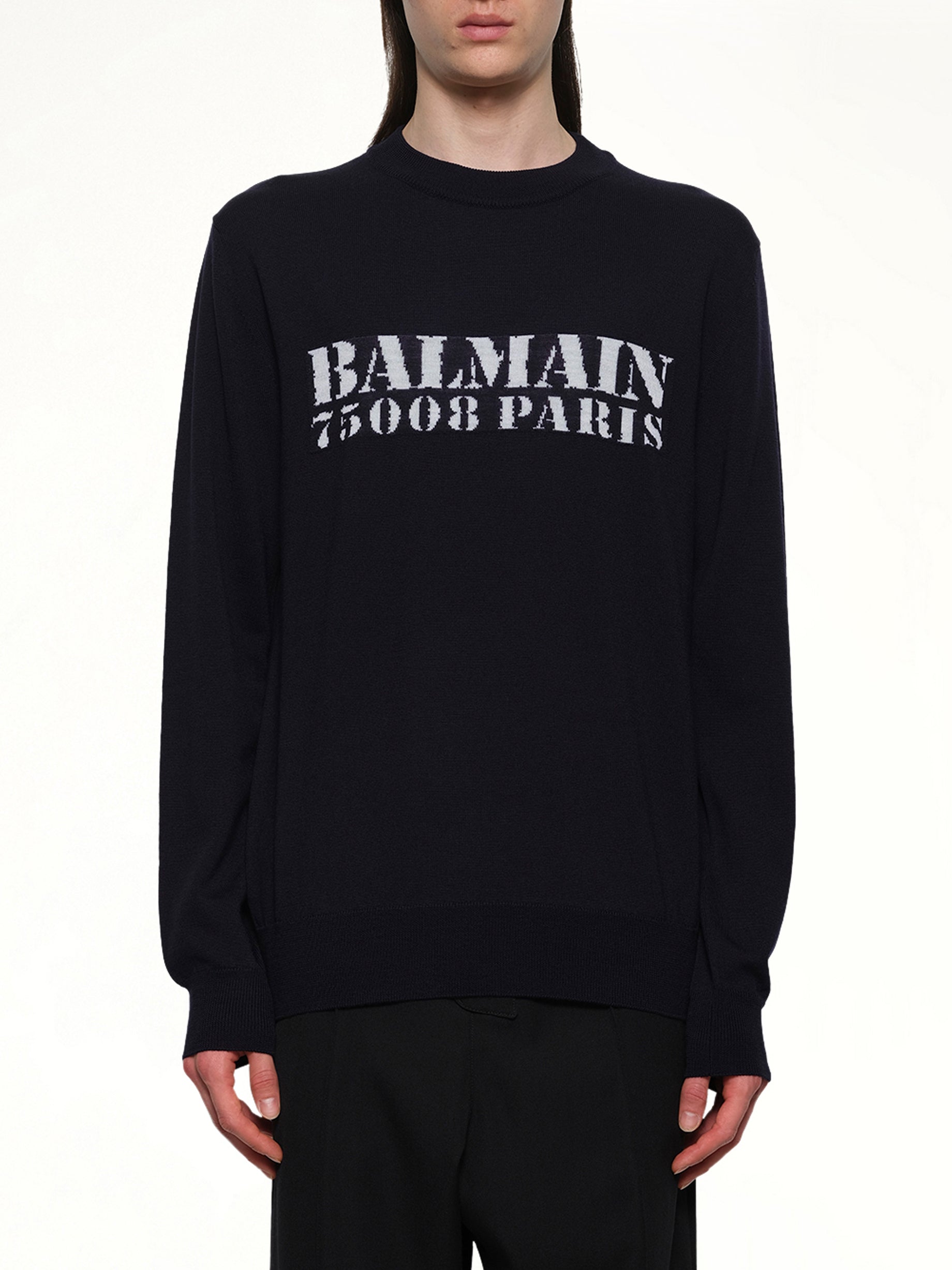 Image of a model wearing Outerwear. Productname: BALMAIN Balmain Big Stamp Knit Sweater in NAVY/WHITE colour by brand - BALMAIN